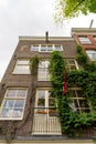 Vertical shot of an apartment facade in Jordaan, Amsterdam