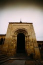 Vertical shot of the arch shaped entrance of the San Milan Church captured in Segovia, Spain