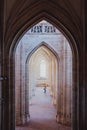 Vertical shot of the arch shaped hallways in an old building