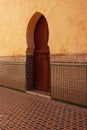 Vertical shot of the arches in the Mausoleum of Moulay Ismail interior in Meknes in Morocco Royalty Free Stock Photo