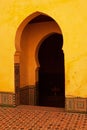 Vertical shot of the arches in Mausoleum of Moulay Ismail interior in Meknes in Morocco