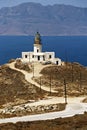 Vertical shot of Armenistis Lighthouse on the shore of the sea in Greece Royalty Free Stock Photo