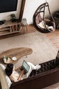 Vertical shot of asian girl student studying at home on sofa, laying on couch and using laptop computer Royalty Free Stock Photo