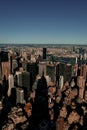 Vertical shot from atop the Empire State Building casting its shadow on the buildings of Manhattan. Royalty Free Stock Photo