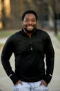 Vertical shot of an attractive African American male smiling at the camera Royalty Free Stock Photo