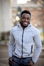 Vertical shot of an attractive African American male smiling at the camera Royalty Free Stock Photo