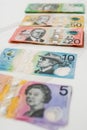 Vertical shot of Australian five ten twenty fifty banknotes on the white background Royalty Free Stock Photo