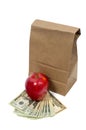 Vertical Brown Bag With Money and Red Apple Royalty Free Stock Photo