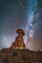 Vertical shot of Balanced Rock in Arches National Park Moab under a vivid Milkyway stars