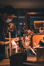 Vertical shot of the barista making coffee at Starbucks at night in Auckland, New Zealand