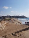 Vertical shot of a beach with people in Tel Aviv, Israel.