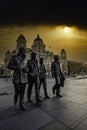 Vertical shot of The Beatles statue in Liverpool captured under the foggy sunset