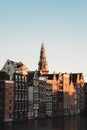 Vertical shot of beautiful Amsterdam waterfront buildings under the blue sky