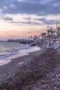 Vertical shot of a beautiful beach in Malaga at sunset Royalty Free Stock Photo