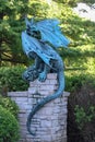 Vertical shot of a beautiful blue statue of a dragon in Peoria Heights