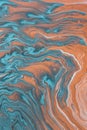 Vertical shot of a beautiful calming background in oily blue and orange pastel colors