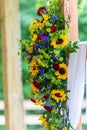 Vertical shot of a beautiful flower composition hanging in the wedding venue