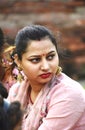 Vertical shot of a beautiful Indian woman with a red bindi and traditional jewelry looking aside Royalty Free Stock Photo