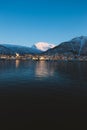 Vertical shot of the beautiful lake surrounded by snow covered mountains in Tromso, Norway Royalty Free Stock Photo