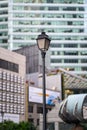 Vertical shot of a beautiful lamppost in the middle of the business district in Singapore