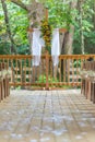 Vertical shot of a beautiful outdoor wedding aisle with decorated with yellow flowers Royalty Free Stock Photo