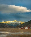 Vertical shot of beautiful rural houses near the Sunndal Mountains in Norway Royalty Free Stock Photo