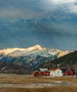 Vertical shot of beautiful rural houses near the Sunndal Mountains in Norway Royalty Free Stock Photo