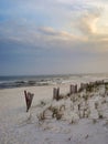 Vertical shot of a beautiful sandy and wavy shoreline along Pensacola Beach, Florida