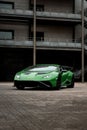 Vertical shot of a beautiful sleek luxurious Lamborghini Huracan Sto parked outdoors Royalty Free Stock Photo