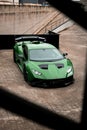 Vertical shot of a beautiful sleek luxurious Lamborghini Huracan Sto parked outdoors Royalty Free Stock Photo