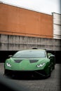 Vertical shot of a beautiful sleek luxurious Lamborghini Huracan Sto parked outdoors