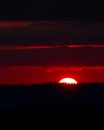 Vertical shot of the beautiful sunset behind the layers of clouds in Oregon Royalty Free Stock Photo