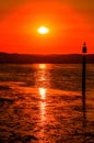 Vertical shot of the beautiful sunset over the calm ocean Royalty Free Stock Photo