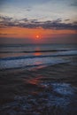 Vertical shot of the beautiful sunset over the ocean at Waverly, New Zealand Royalty Free Stock Photo