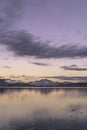 Vertical shot of the beautiful sunset sky over the lake Royalty Free Stock Photo