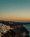 Vertical shot of a beautiful sunset sky over the shore of Thira, Santorini, Greece Royalty Free Stock Photo