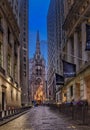 Vertical shot of the beautiful Trinity Church on Wall Street at night in New York, Manhattan, USA Royalty Free Stock Photo