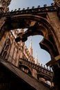 Vertical shot of a beautiful view of Duomo di Milano and an antique arch in Milan, Italy