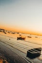 Vertical shot of a beautiful view of fishing boats near coast at sunset Royalty Free Stock Photo