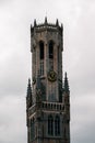 Vertical shot of Belfry of Bruges in Bruges, Belgium on a cloudy day Royalty Free Stock Photo