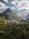 Vertical shot of the Berliner Hut in the Austrian Alps against background of high mountains