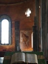 Vertical shot of the Bible placed on a tribune in a Christian church