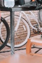 Vertical shot of a bicycle behind a table