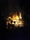 Vertical shot of a big bonfire at night. Royalty Free Stock Photo