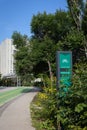 Vertical shot of a bike path with a cycling counter on the sidewalk, sunny day in Winnipeg, Canada