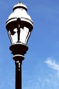 Vertical shot of a black and white street lamp under the blue sky Royalty Free Stock Photo