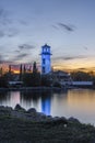 Vertical shot of a blue lighthouse near the shore of Sylvan Lake in Alberta, Canada Royalty Free Stock Photo