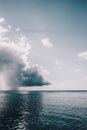 Vertical shot of the blue ocean under the cloudy sky - perfect for wallpaper Royalty Free Stock Photo