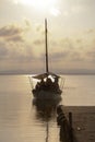 Vertical shot of a boat arriving at a pier in Valencia, Spain