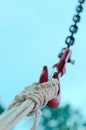 Vertical shot of a boat rope attached to the port anchor hook